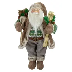 Northlight 18" Standing Santa Christmas Figure Carrying Presents and Skis Brown