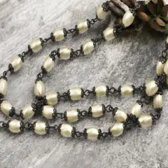 10x6mm Czech Glass Cream Twisted Oval Pearl Chain w/ Black Caps