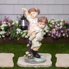 Northlight LED Solar Lighted Boy and Girl with Lantern Outdoor Garden Statue - 19.5" Multi