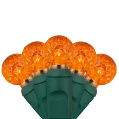 70 Amber/Orange G12 LED String Lights, Green Wire, 4" Spacing