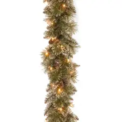 9' x 10" Pre-lit Glittery Bristle&reg; Pine Artificial Christmas Garland with White Tipped Cones and 50 Clear Lights