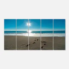 Designart - Blue Sea and Footprints in Sand - Large Seascape Art Canvas Print