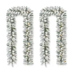 Glitzhome&reg; 6ft. Pre-Lit Snow Flocked Christmas Garland, 2ct.