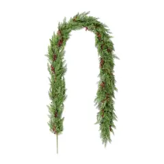 Glitzhome&reg; 9ft Christmas Greenery PE Cedar Garland with Red Berries