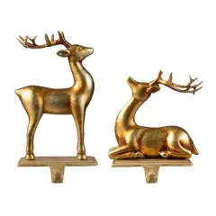 Glitzhome&reg; Gold Standing & Sitting Reindeer Stocking Holder Set