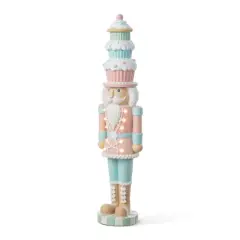 Glitzhome&reg; 28" Lighted Resin Christmas Cupcake Nutcracker Porch Decor with Timer