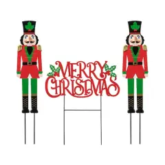 Glitzhome&reg; Metal Nutcrackers & "MERRY CHRISTMAS" Yard Stake Set
