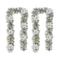 Glitzhome&reg; 2 Pack 9ft. Pre-Lit Snow Flocked Greenery Pine Poinsettia Christmas Garland