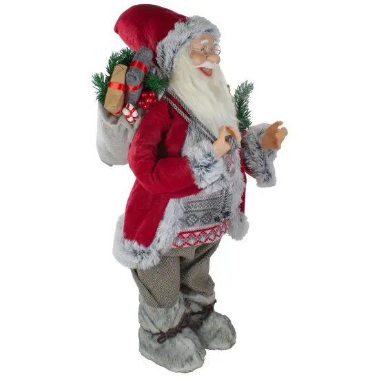 Northlight 2' Standing Santa Christmas Figure Carrying Snow Shoes and Presents Red {4}