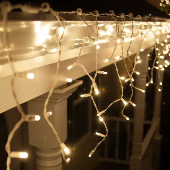 70 Warm White Twinkle 5mm LED Icicle Light Set with White Wire {3}