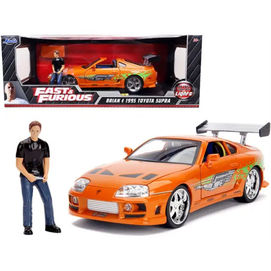 1995 Toyota Supra Orange Metallic With Lights And Brian Figurine "Fast & Furious" Movie 1/18 Diecast Model Car By Jada {1}