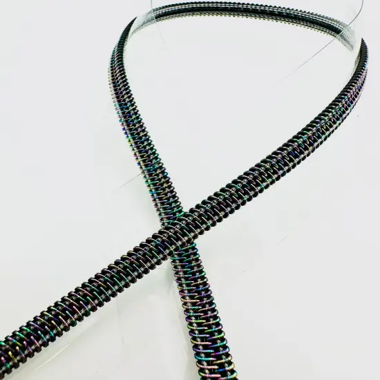 Clear vinyl zipper tape with iridescent teeth {1}