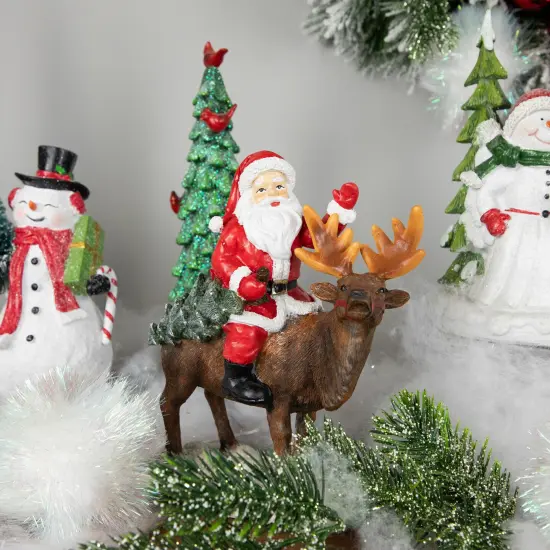 Northlight Santa Claus on a Reindeer Holding a Frosted Pine Tree Christmas Figurine - 8.25" Red {3}