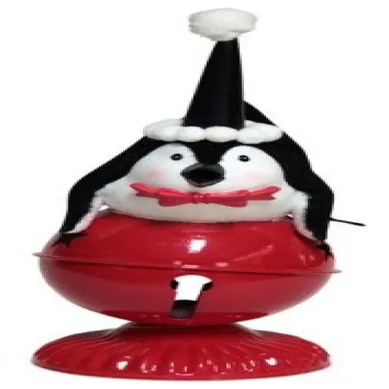 Melrose 10.5" Playful Glittered Black and White Penquin Laying on Large Red Jingle Bell Christmas Table Top Decoration {1}