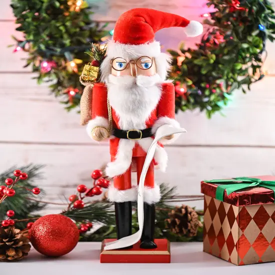 Ornativity Christmas Gift Santa Nutcracker &ndash; Red and White Wooden Nutcracker Santa Man in Traditional Santa Attire with a Bag of Gold Wrapped Gifts Over His Shoulder and a List of Names in Hand {3}