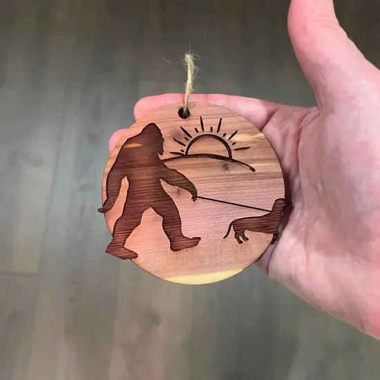 Sasquatch walking his dog - Cedar Ornament {4}