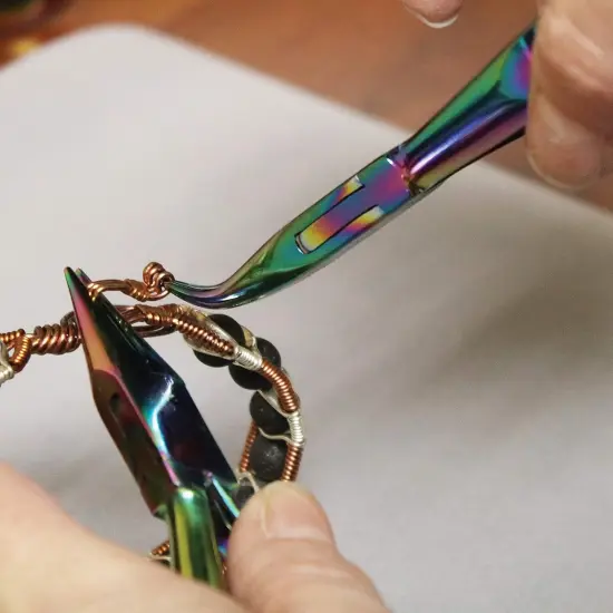 The Beadsmith Chroma Series Bent Chain Nose Plier, 5.5 inches (140mm), hardened stainless-steel head, rainbow titanium coating, contoured comfort grip handle and double-leaf spring {5}