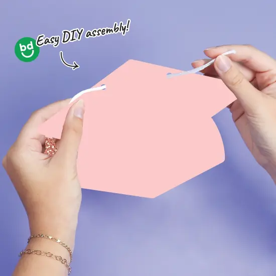 Big Dot of Happiness Rose Gold Graduation Cap Garland Banner, High School or Elementary Grad Photo Backdrop, 10 Feet of Cord, 15 Hats with Tassels {5}