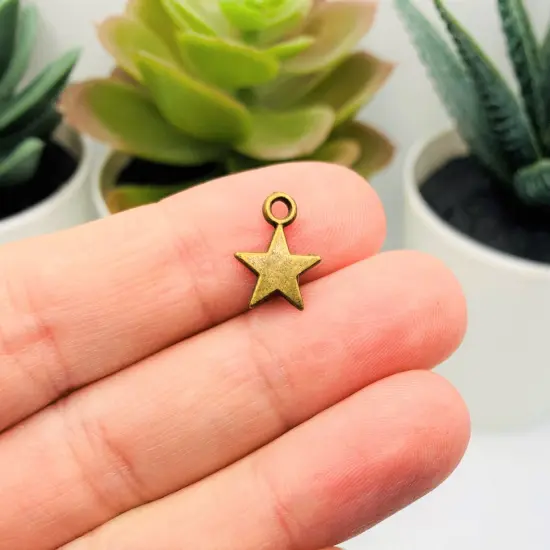 Small Bronze Star Charms, 8x11mm {2}