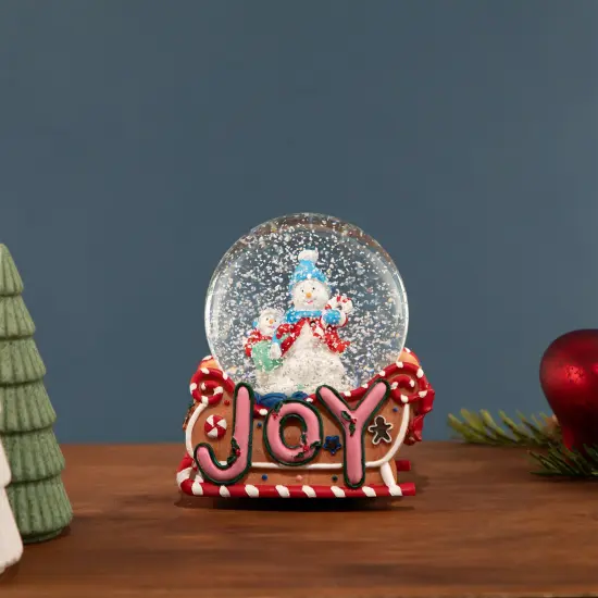 Northlight Musical Joy Gingerbread Sleigh with Snowman Christmas Snow Globe - 5.25" Pink {1}