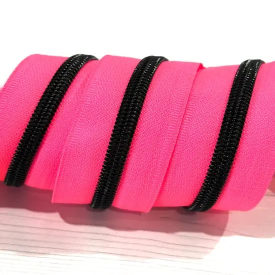 Black teeth on neon pink zipper tape {1}