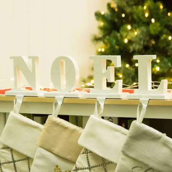 Glitzhome&reg; Christmas Noel Stocking Holder Set {4}