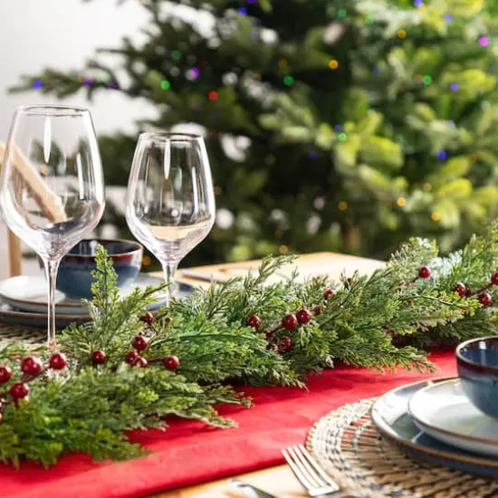 Glitzhome&reg; 9ft Christmas Greenery PE Cedar Garland with Red Berries {5}