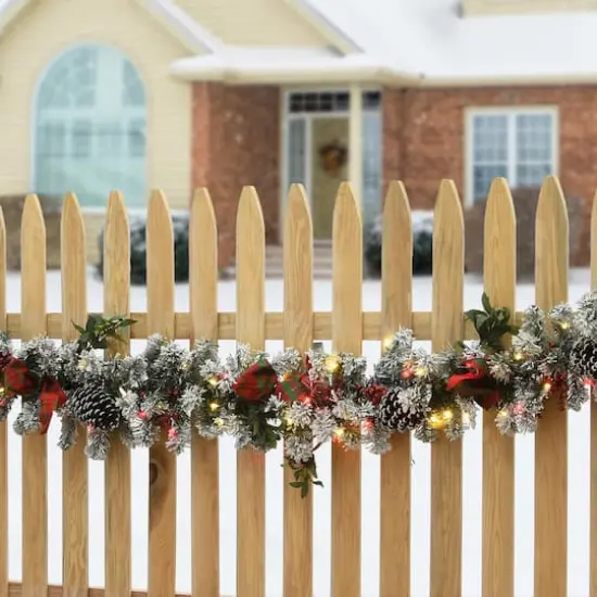 9ft. General Store Snowy Garland with LED Lights & Bows {3}