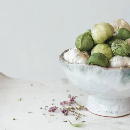 Hello Honey® 9" Green & Brown Stoneware Footed Bowl with Speckled Glaze {8}