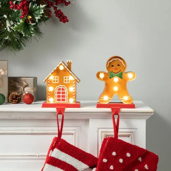 Glitzhome&reg; Marquee LED Gingerbread House & Gingerbread Man Christmas Stocking Holder Set {4}