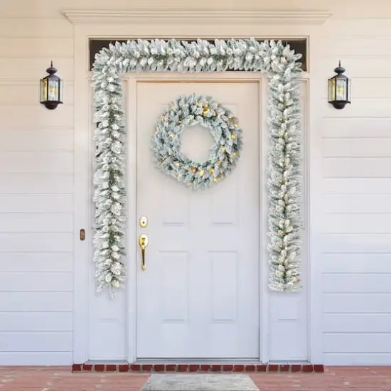 Glitzhome&reg; 6ft. Pre-Lit Snow Flocked Christmas Garland, 2ct. {3}