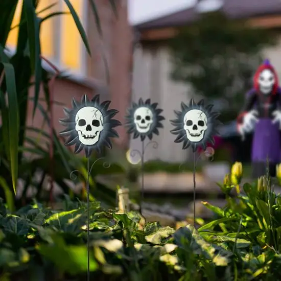 Glitzhome&reg; 24" Halloween Metal Sunflower Skulls Glow-in-Dark Yard Stakes, 3ct. {3}