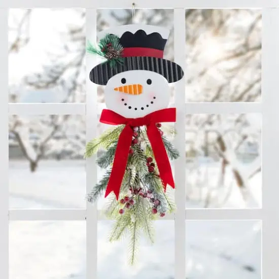 Glitzhome&reg; 25" Greenery Snowman Door Hanger {3}