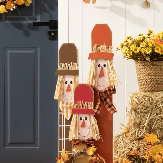 Glitzhome&reg; 36.25" Wooden Scarecrow Family Porch D&eacute;cor with Lighted Wreath & Timer {13}