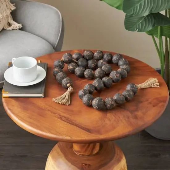 5ft. Paper Mache Round Distressed Beaded Garland with Tassel Black {11}