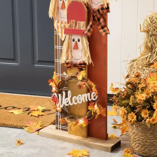 Glitzhome&reg; 36.25" Wooden Scarecrow Family Porch D&eacute;cor with Lighted Wreath & Timer {14}