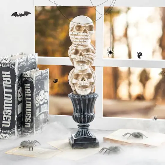 Glitzhome&reg; 18"H Halloween Resin Stacked Skull Table Decor {3}
