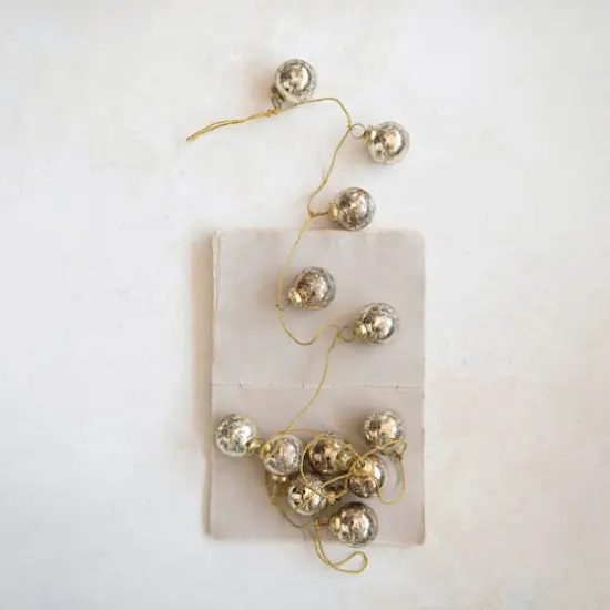 Hello Honey® 6ft. Antique Gold Etched Mercury Glass Ball Ornament Garland with Snowflakes {4}