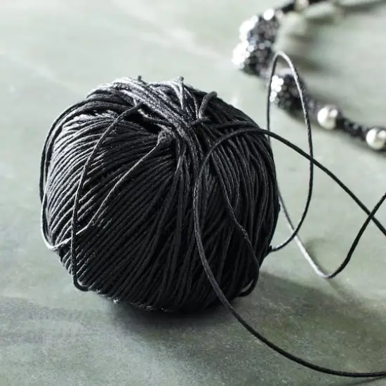 Bead Landing&trade; Waxed Cotton Cord Ball, 200 ft. Black {3}