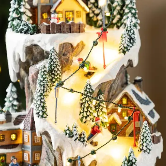 Glitzhome® 15.5" Lighted Christmas Skiing Moutain Resin Village with Movement and Music {5}