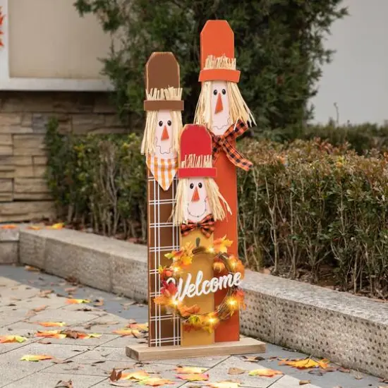 Glitzhome&reg; 36.25" Wooden Scarecrow Family Porch D&eacute;cor with Lighted Wreath & Timer {4}