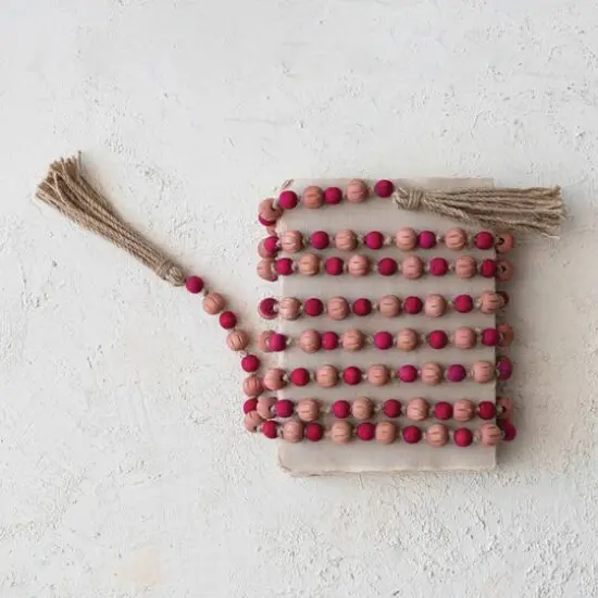 Hello Honey® 12ft. Pink & Red Paulownia Wood Beads with Jute Tassels Garland {5}