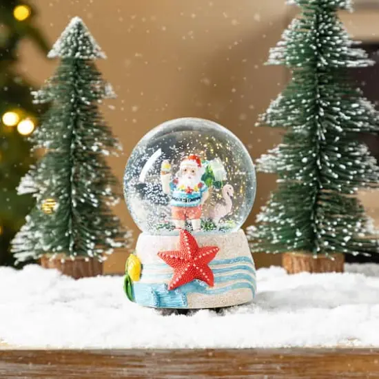 Glitzhome&reg; 100mm Christmas Resin Musical Snowflakes Santa on Vacation Waterglobe {5}