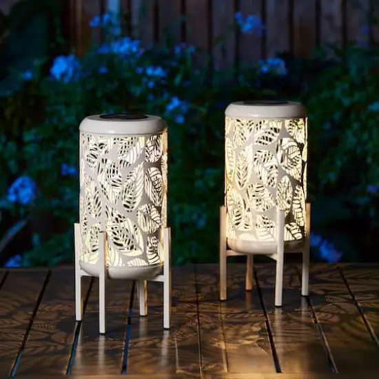 Glitzhome&reg; 14.25" White Metal Cutout Leaves Pattern Solar Powered LED Outdoor Lanterns, 2ct. {6}