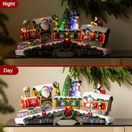 Glitzhome&reg; 20" Lighted Christmas Santa Train Resin Village with Movement and Music {8}