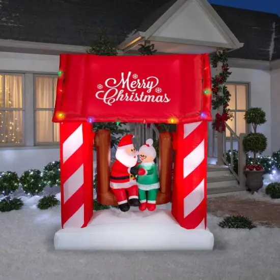7ft. Animated Airblown&reg; Inflatable Christmas Mr. & Mrs. Claus on Swing {3}