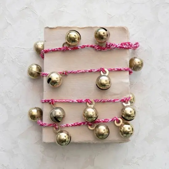 Hello Honey&reg; 6ft. Gold Finish Metal Bells on Braided Red & White Cord Garland {3}