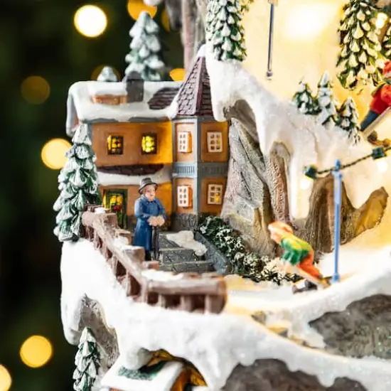 Glitzhome® 15.5" Lighted Christmas Skiing Moutain Resin Village with Movement and Music {6}