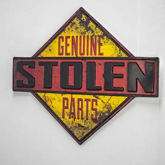 American Art D&eacute;cor&trade; 18.25" Genuine Stolen Parts Embossed Metal Sign {6}