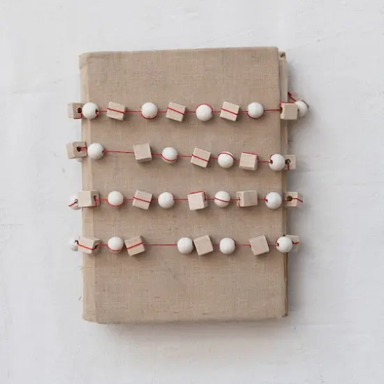 Hello Honey&reg; 6ft. Paulownia Wood Mixed Shapes Beads & Red String Garland {4}